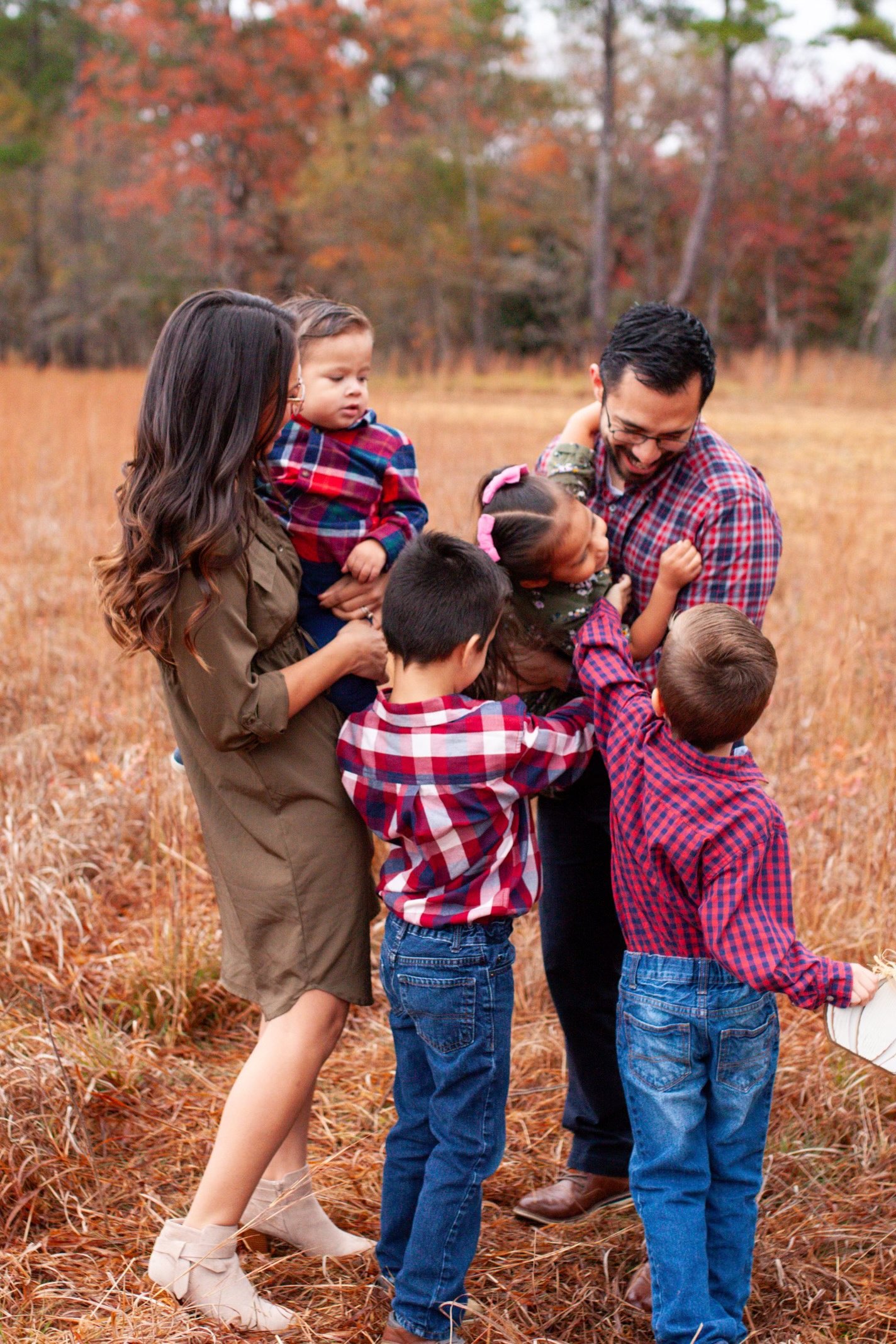 Golfran Rivera with his wife Desiree Rivera and their four children. Family portrait together in Fayetteville, NC.